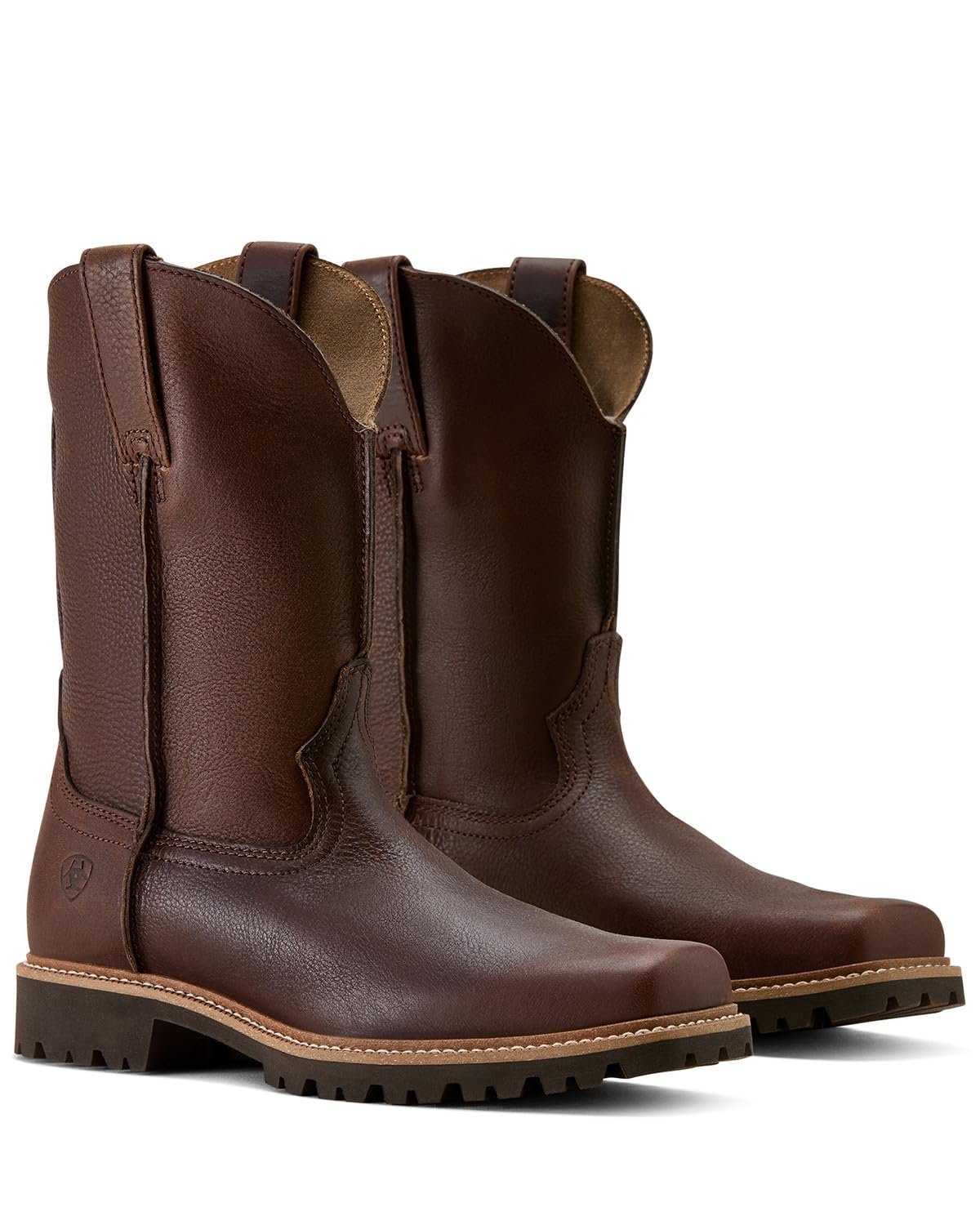 Pair of brown leather boots on a white background