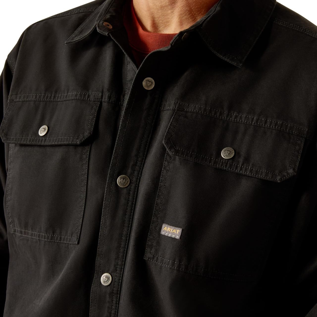 Close-up of the Snap Closure of Ariat Men's Rebar Canvas Shirt Jacket in Black