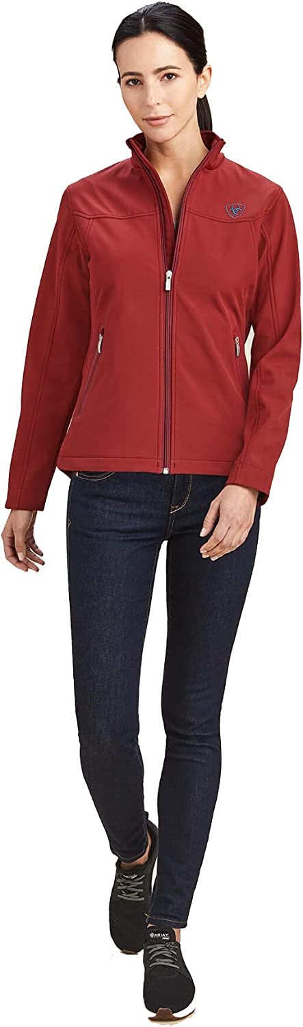 Woman Wearing Ariat Women's New Team Softshell Jacket in Rouge Red/Celestial Serape