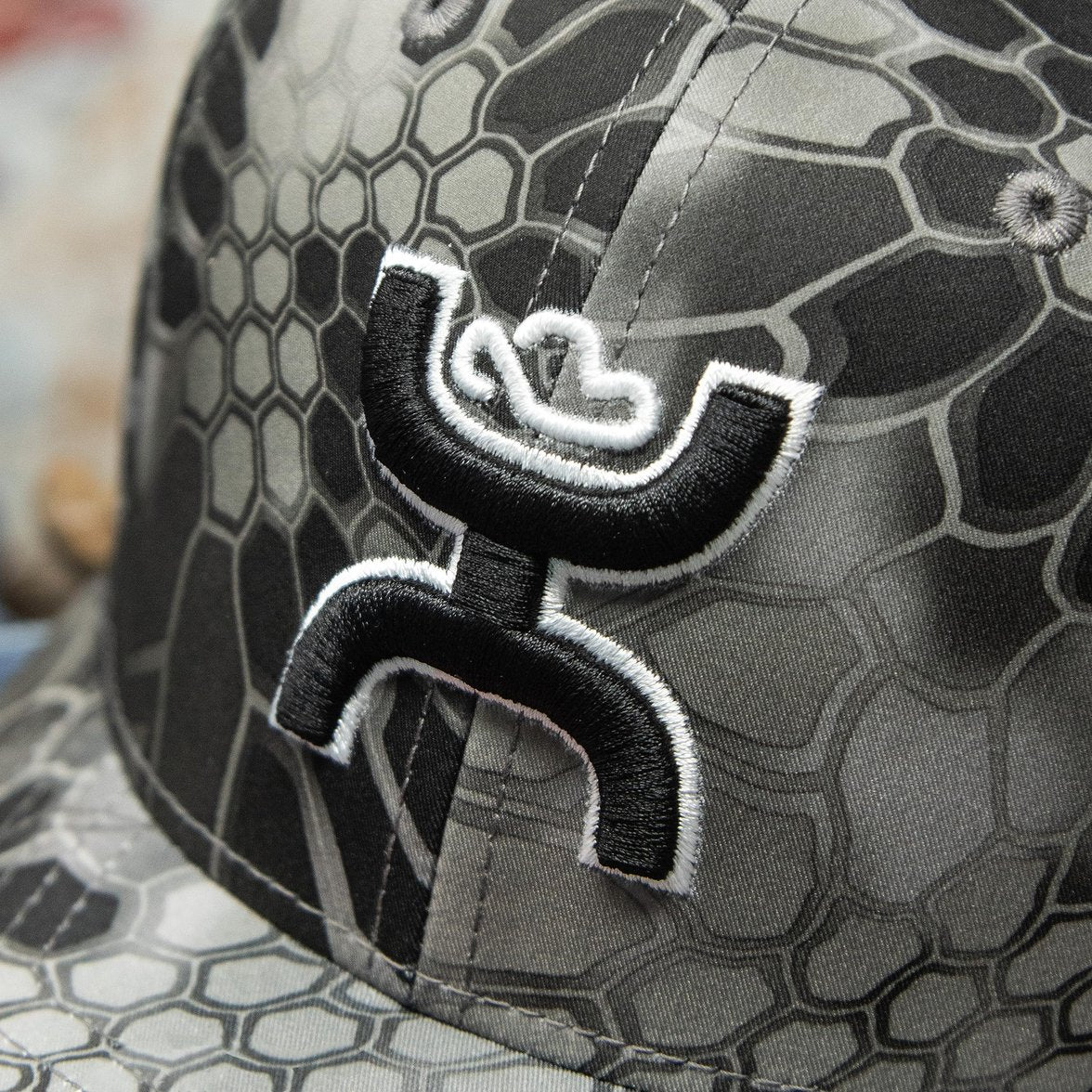 Hooey logo close-up on Hooey Men's Chris Kyle Flexfit Fitted Hat, Grey Camo, Large/X-Large