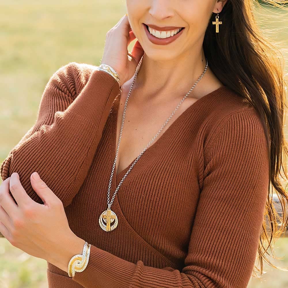 Woman Wearing Montana Silversmiths Gold Cross Necklace