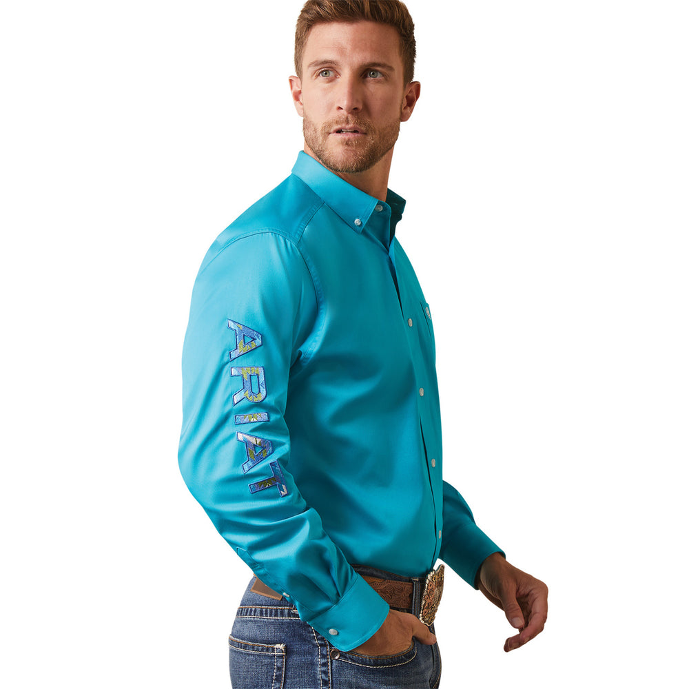 
                  
                    Side Angled Profile of Model Wearing Ariat Men's Team Logo Twill Classic Fit Button Down Shirt
                  
                