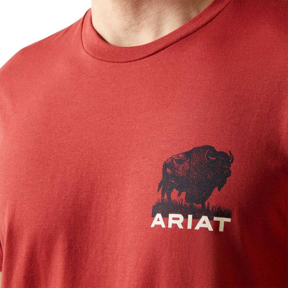 
                  
                    Red t-shirt with a black bison graphic and 'Ariat' logo on a white background
                  
                