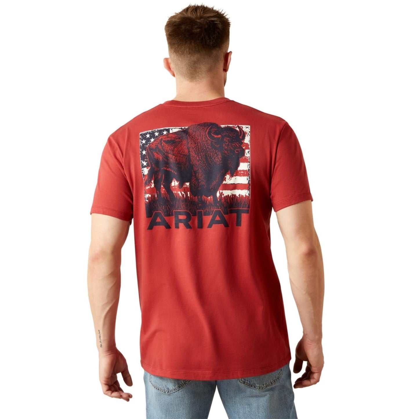Man wearing a red t-shirt with a graphic design and 'Ariat' branding on the back.