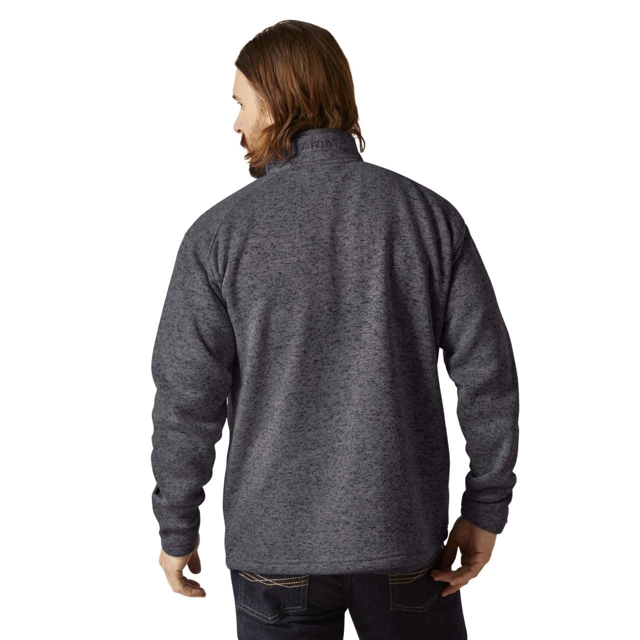 Person wearing a gray fleece jacket on a white background