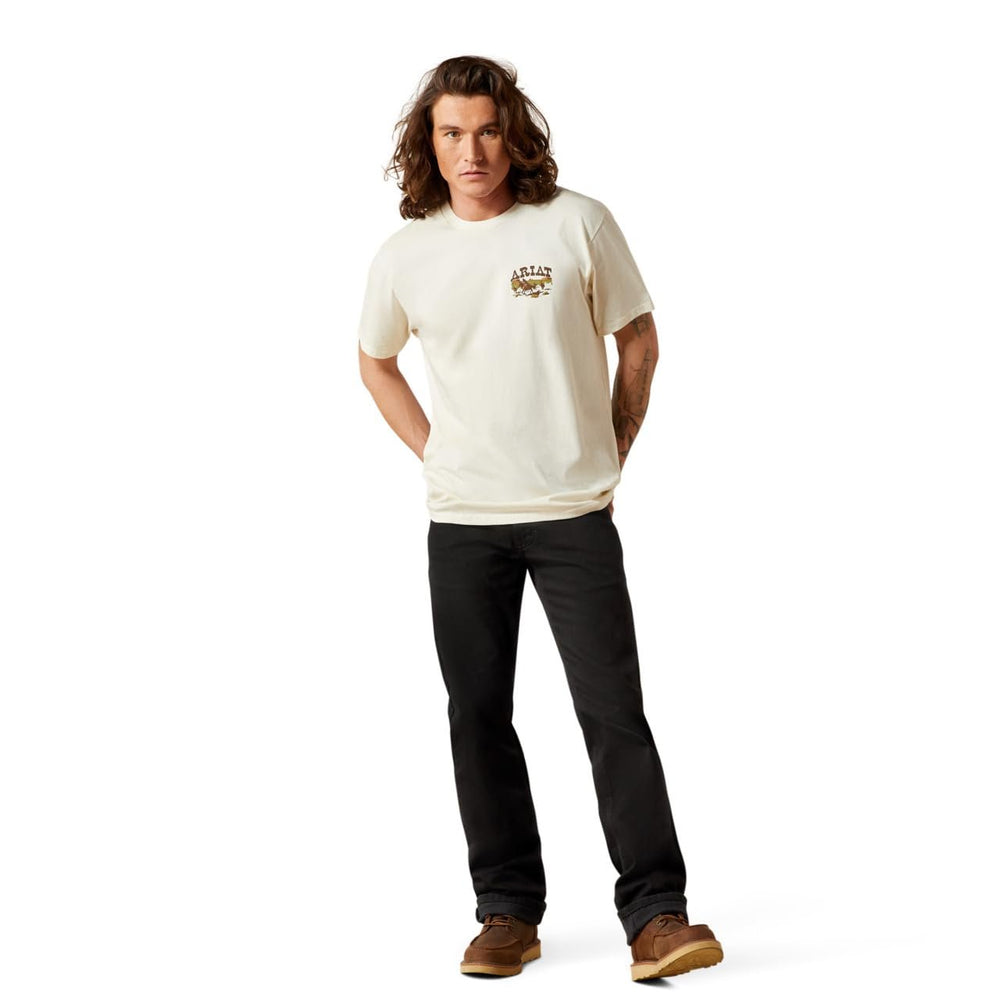 
                  
                    Man wearing a white t-shirt with a logo and dark jeans on a white background
                  
                