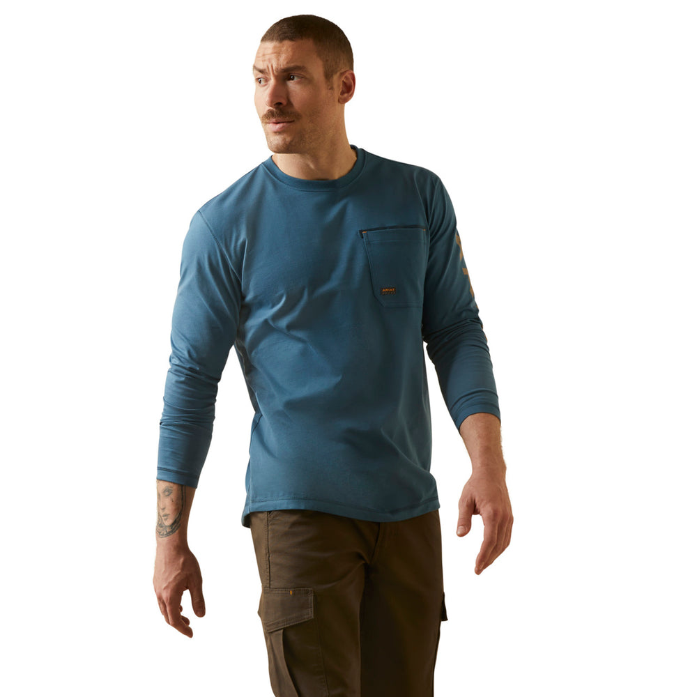 Man wearing a blue long-sleeve shirt with a logo on a white background