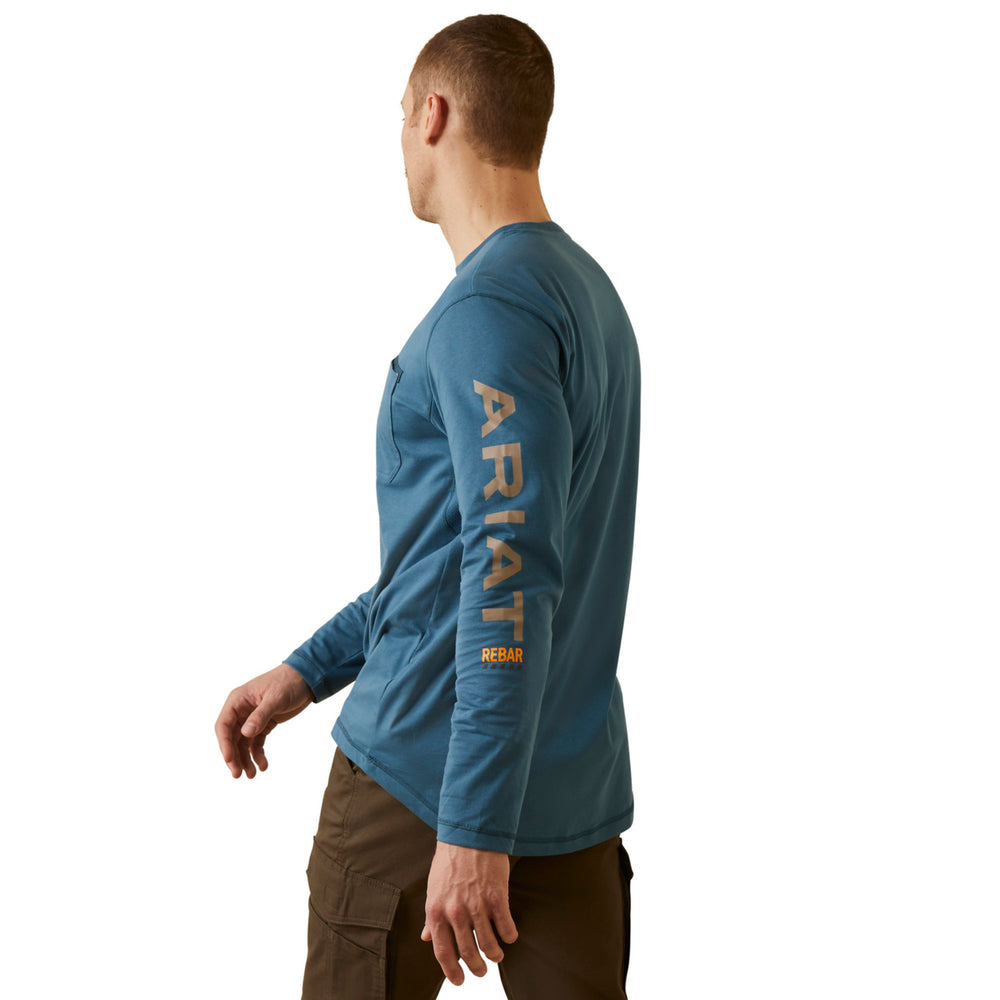 
                  
                    Man wearing a blue Ariat long-sleeve shirt on a white background
                  
                