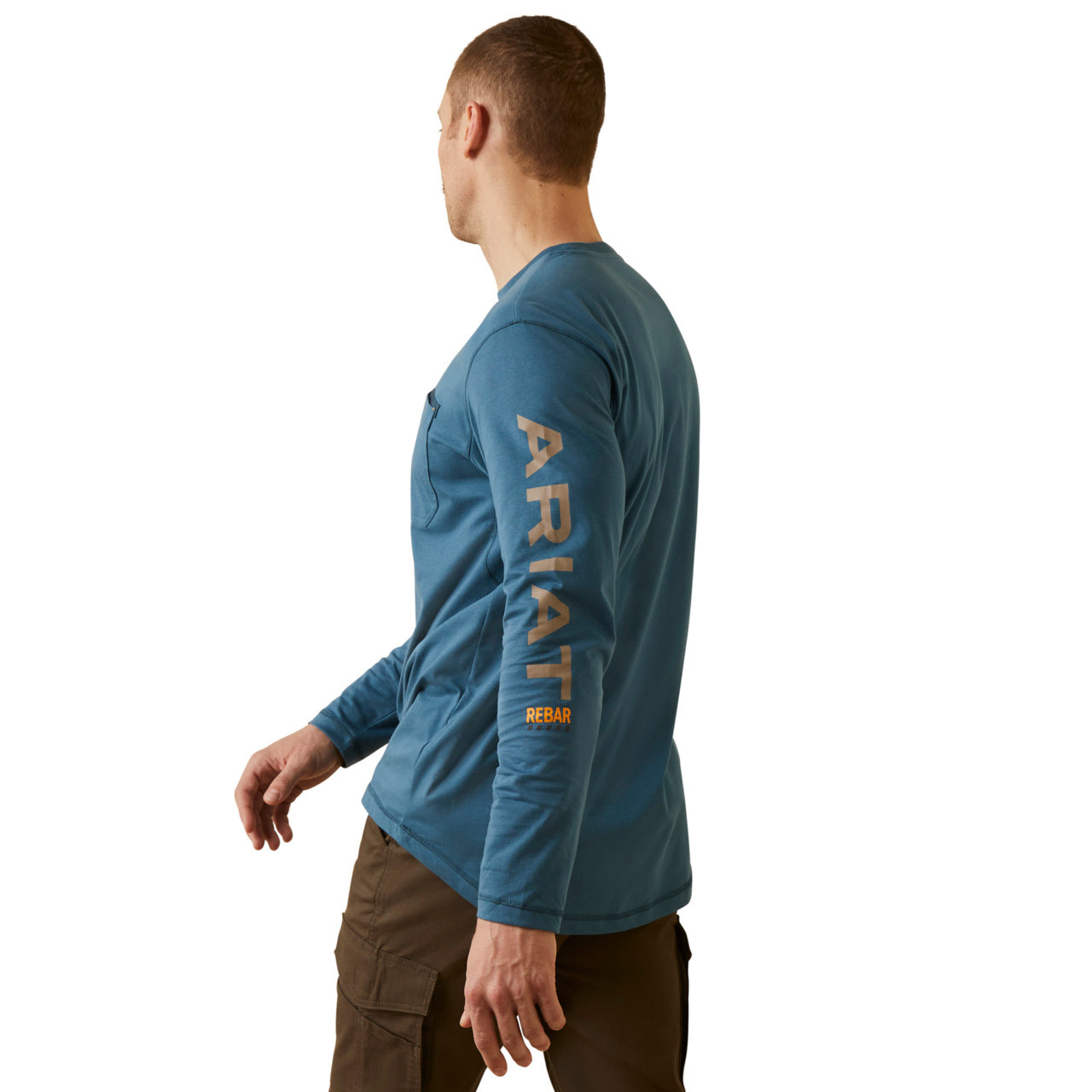 Man wearing a blue Ariat long-sleeve shirt on a white background