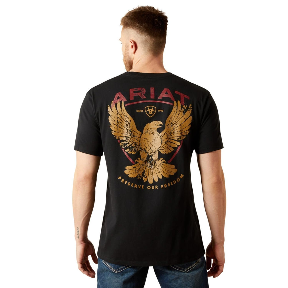 
                  
                    Man wearing a black Ariat t-shirt with an eagle design on the back
                  
                