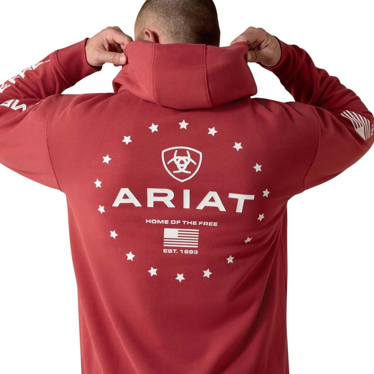 Red hoodie with Ariat logo and branding on the back, worn by a person.