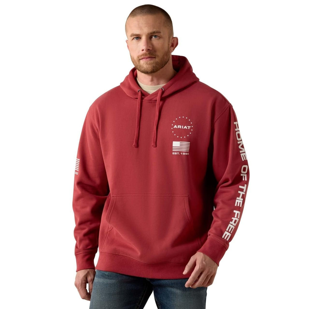 Man wearing a red hoodie with branding on a white background