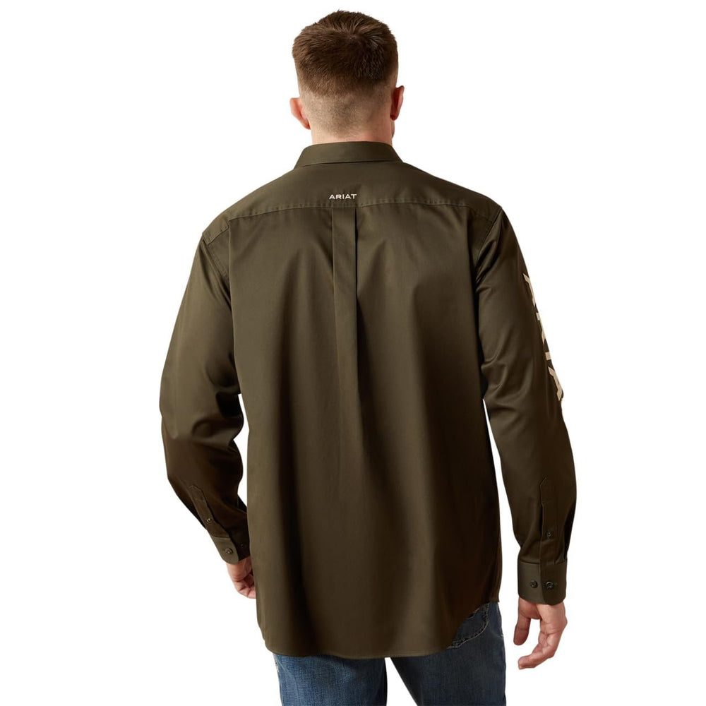 Man wearing a brown shirt with 'Ariat' branding on the back, standing against a white background.