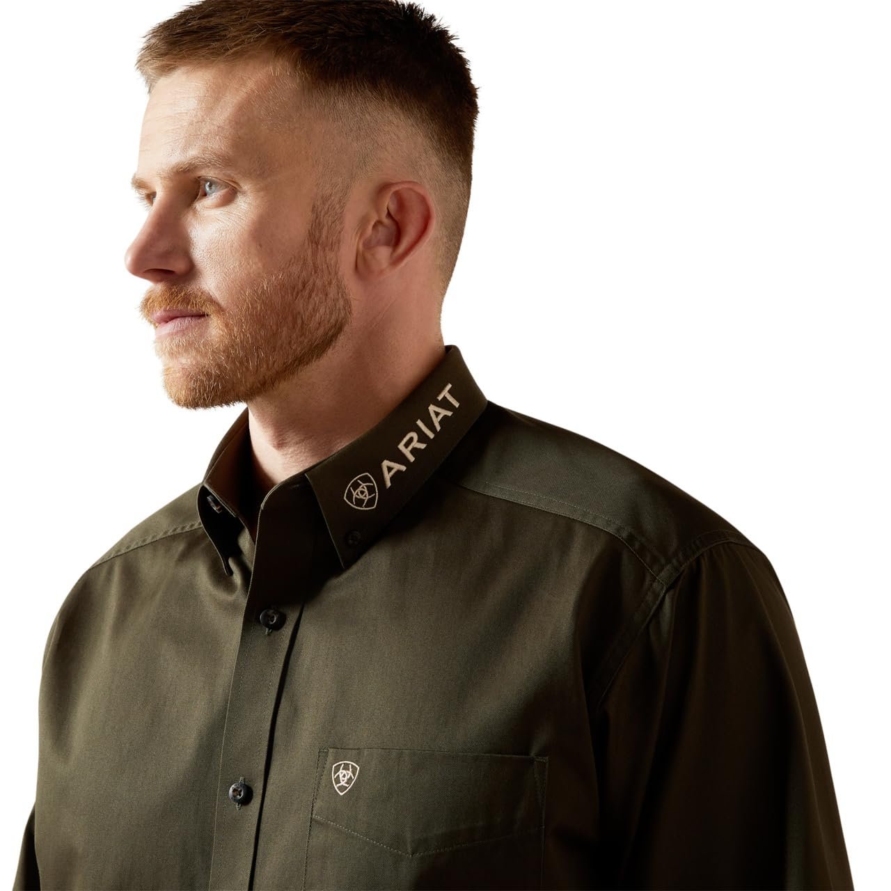 Man wearing a green Ariat shirt on a white background
