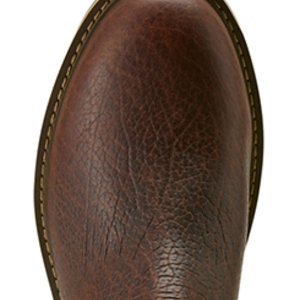 
                  
                    Close-up of a brown leather boot sole on a white background
                  
                
