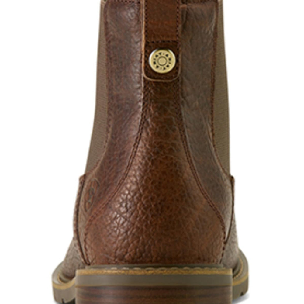 
                  
                    Brown leather boot with a visible brand logo on a white background
                  
                