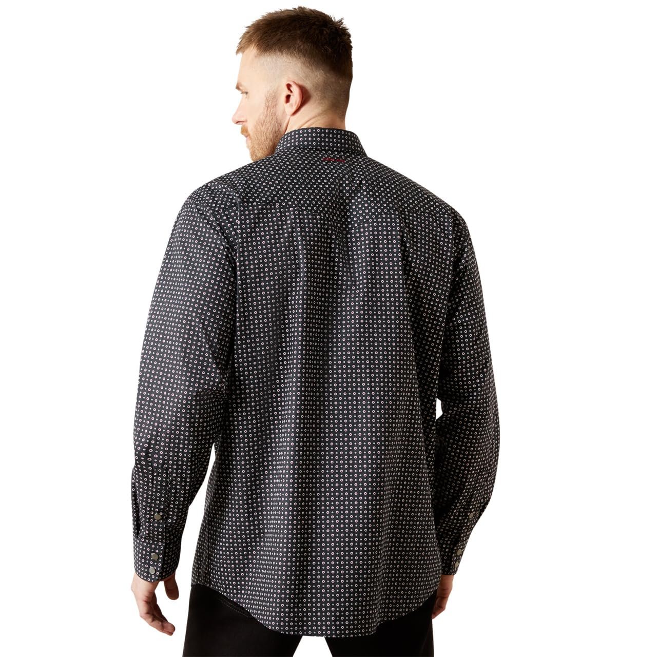 Man wearing a black patterned shirt on a white background