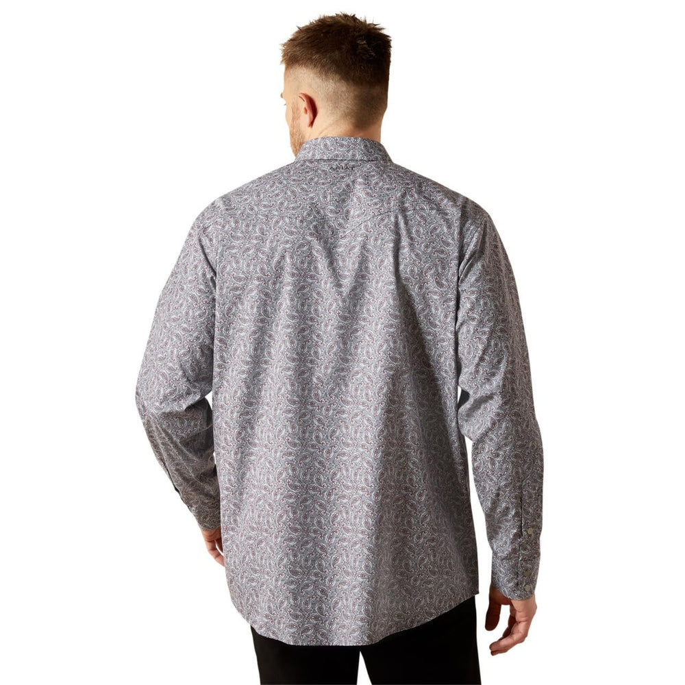 Man wearing a gray patterned shirt on a white background