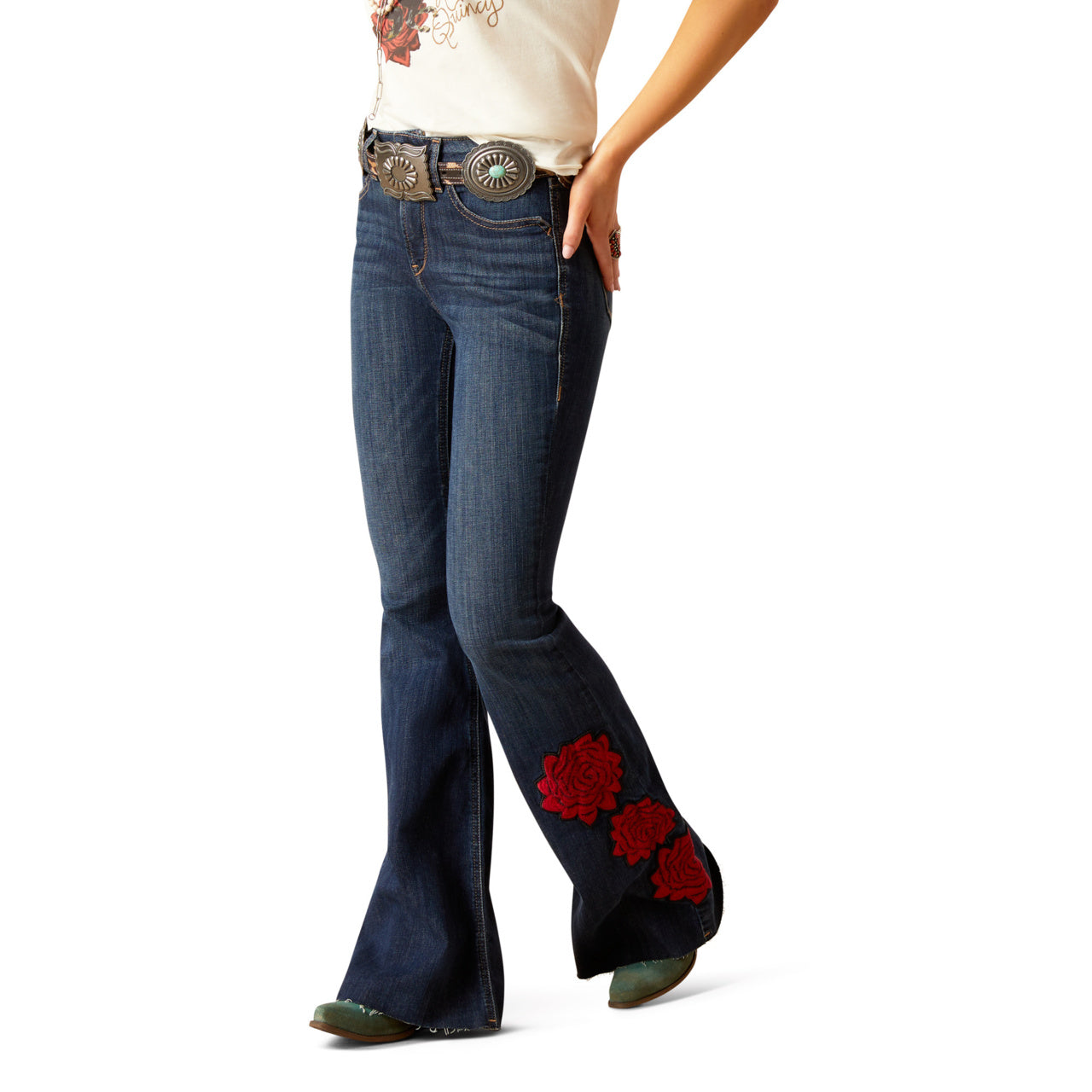 Flared jeans with red floral designs on a white background