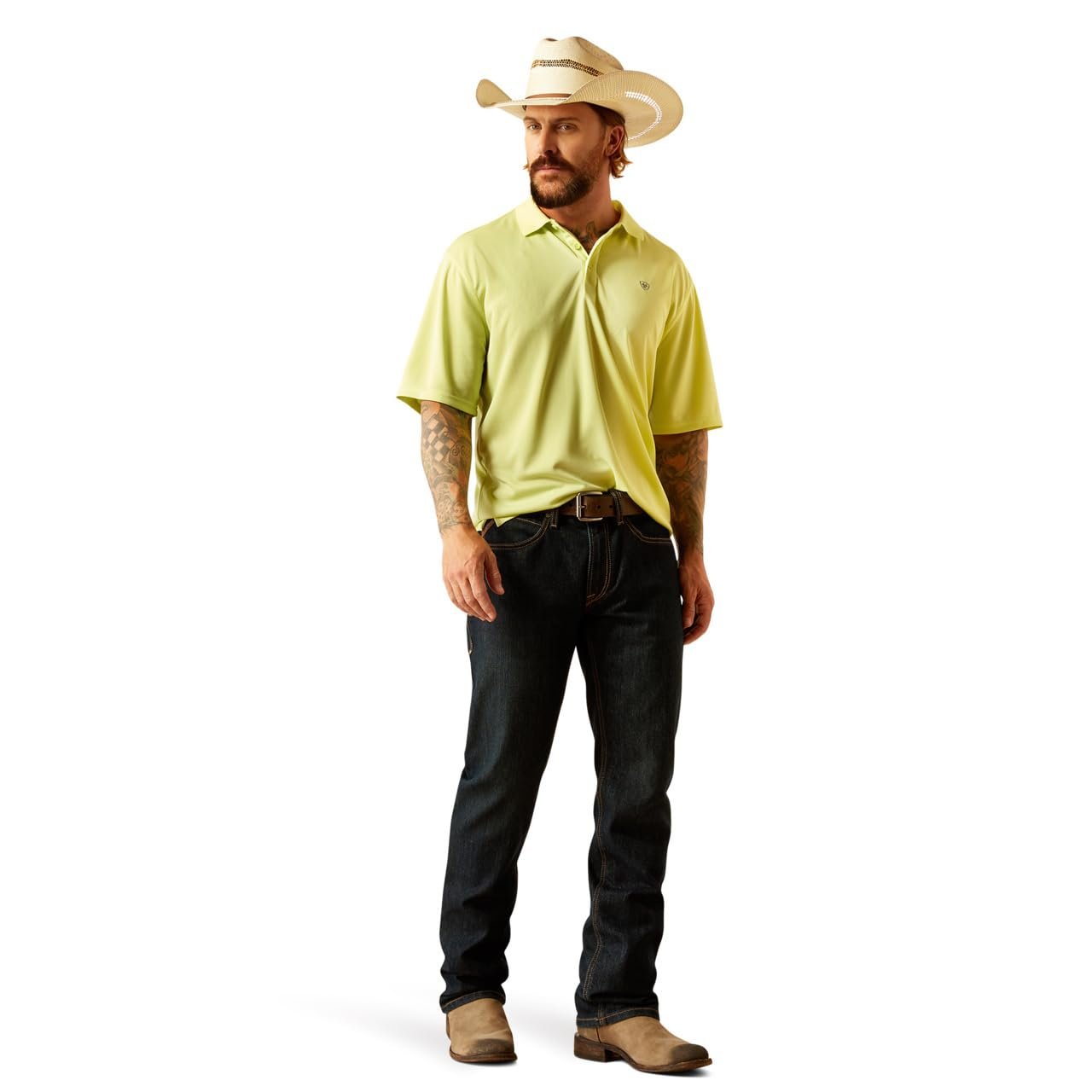 Man wearing a yellow polo shirt, dark jeans, and a cowboy hat on a white background