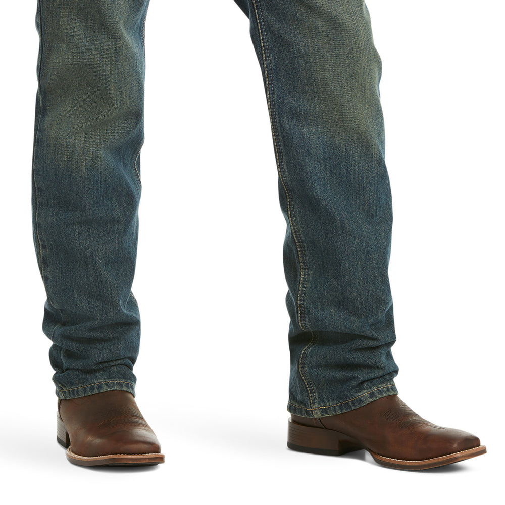
                  
                    Blue jeans and brown boots on a white background
                  
                