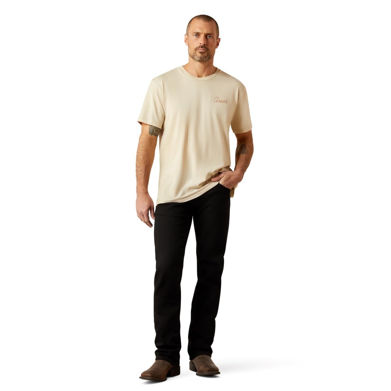 Man wearing a beige t-shirt and black pants on a white background