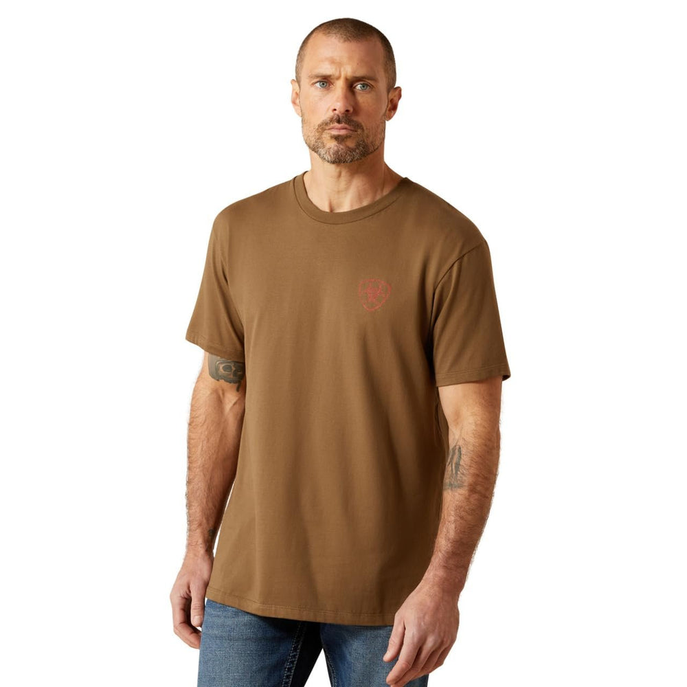 Man wearing a brown t-shirt with a small red logo on a white background