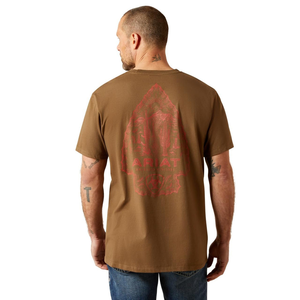 
                  
                    Man wearing a brown t-shirt with a red graphic on the back, standing against a white background
                  
                