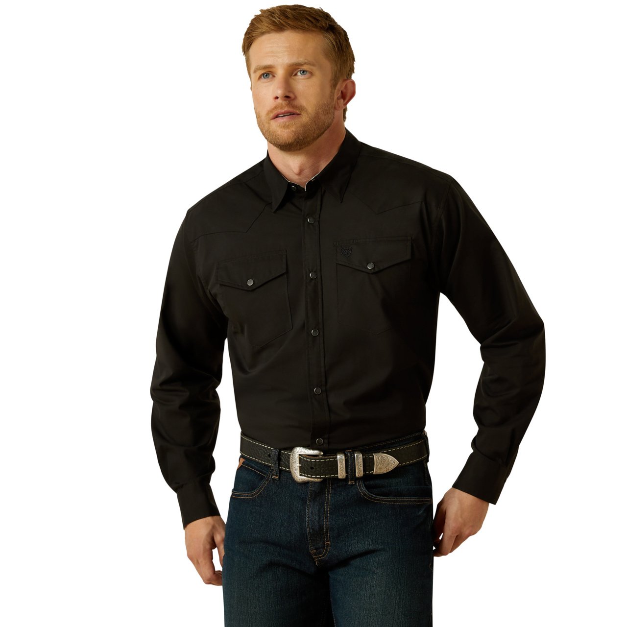 Man wearing a black shirt and jeans on a white background