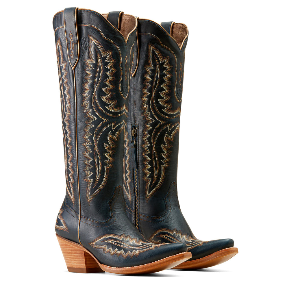 
                  
                    Pair of black cowboy boots with intricate brown embroidery on a white background
                  
                