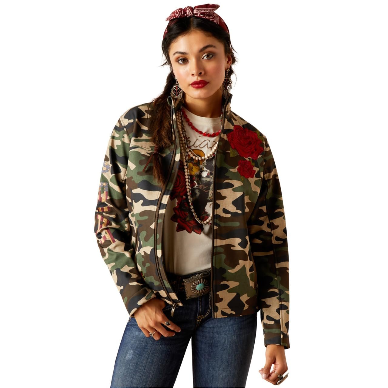 Woman wearing a camouflage jacket with floral patterns on a white background