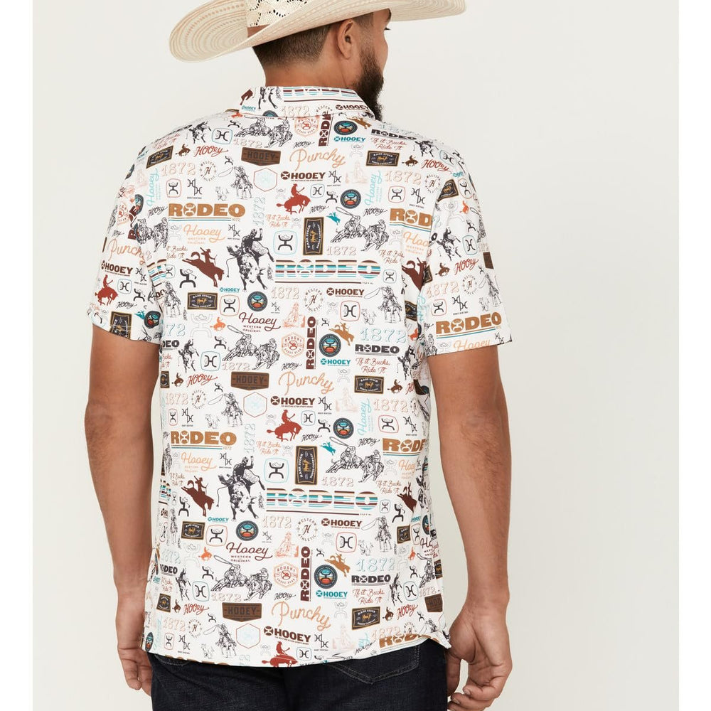 
                  
                    Man wearing a patterned shirt with 'rodeo' text and images, paired with a cowboy hat on a white background.
                  
                