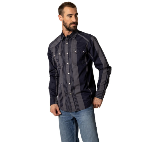 Man wearing a dark patterned shirt and jeans on a white background