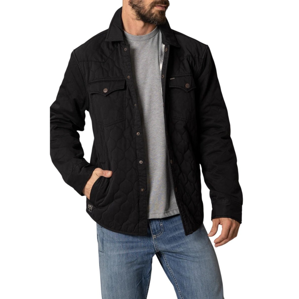 Man wearing a black jacket, gray shirt, and blue jeans on a white background