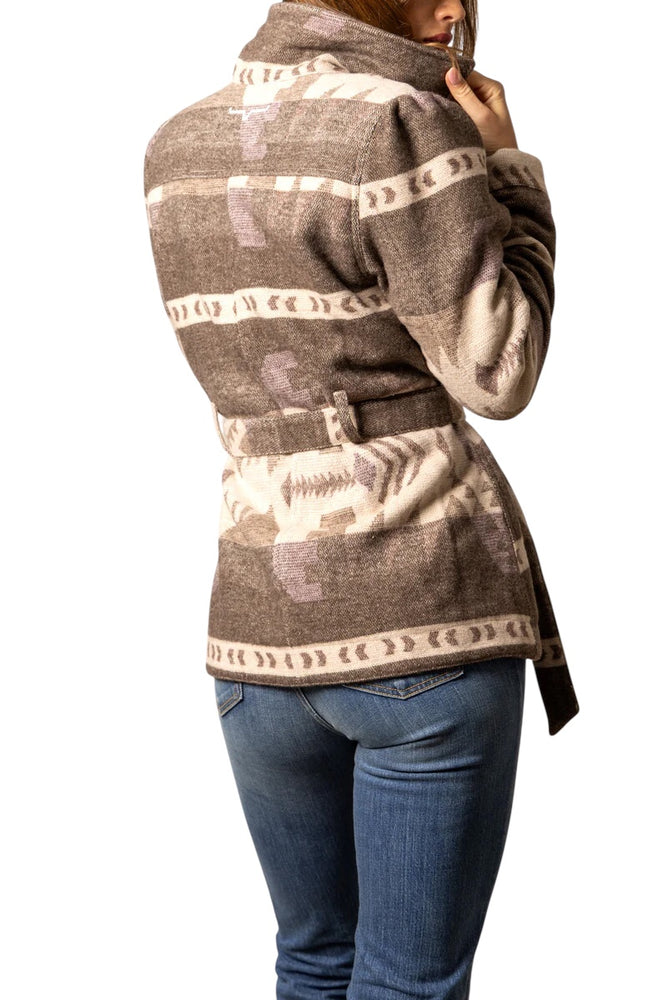 
                  
                    Person wearing a patterned jacket with a white background
                  
                