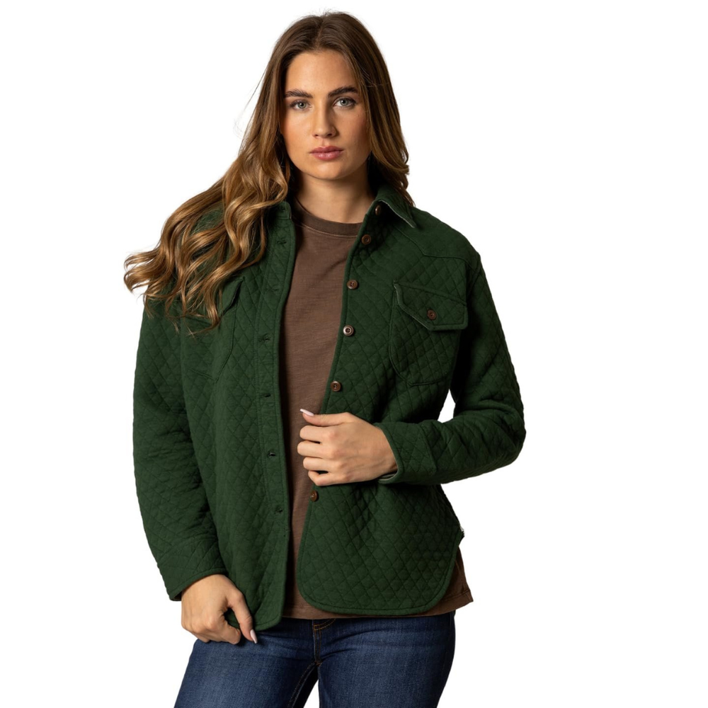 Woman wearing a green quilted jacket on a white background