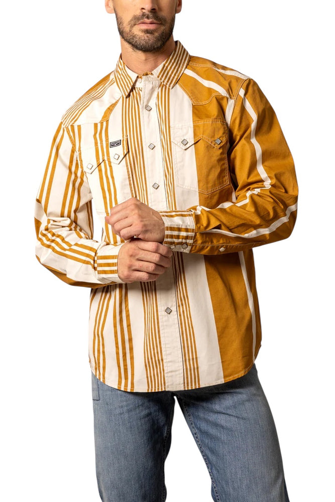 
                  
                    Man wearing a mustard yellow and white striped shirt with blue jeans on a white background
                  
                