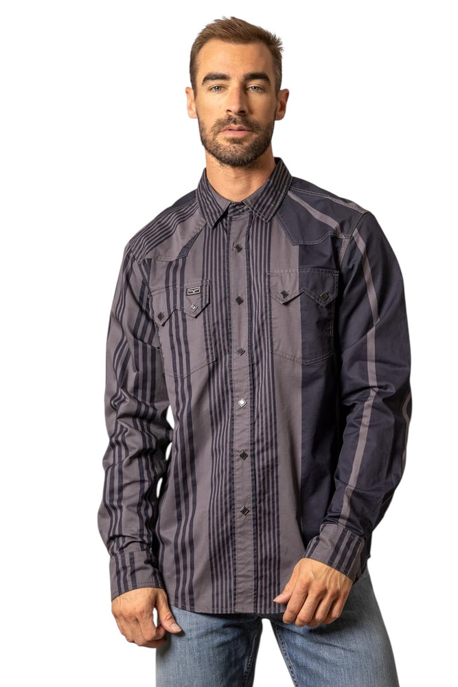 
                  
                    Man wearing a dark patterned shirt on a white background
                  
                