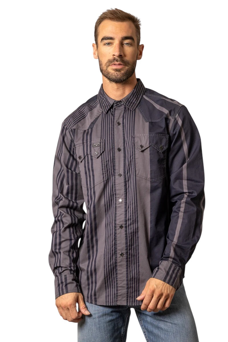 Man wearing a dark patterned shirt on a white background