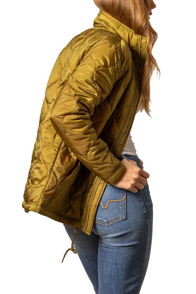 
                  
                    Person wearing a mustard yellow quilted jacket and blue jeans on a white background
                  
                