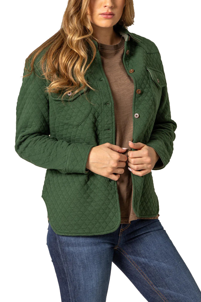 Woman wearing a green quilted jacket on a white background
