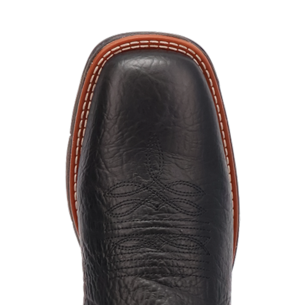 
                  
                    Close-up of a black leather boot with brown stitching on a white background
                  
                