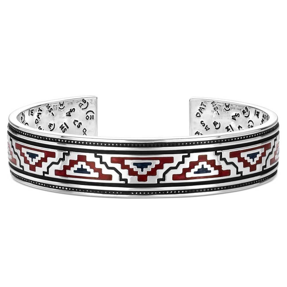 Cuff bracelet with geometric pattern on a white background