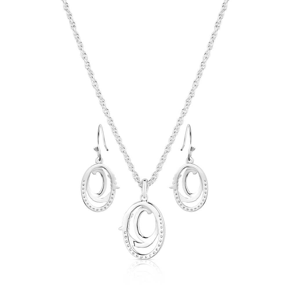 Silver necklace and earrings set on a white background