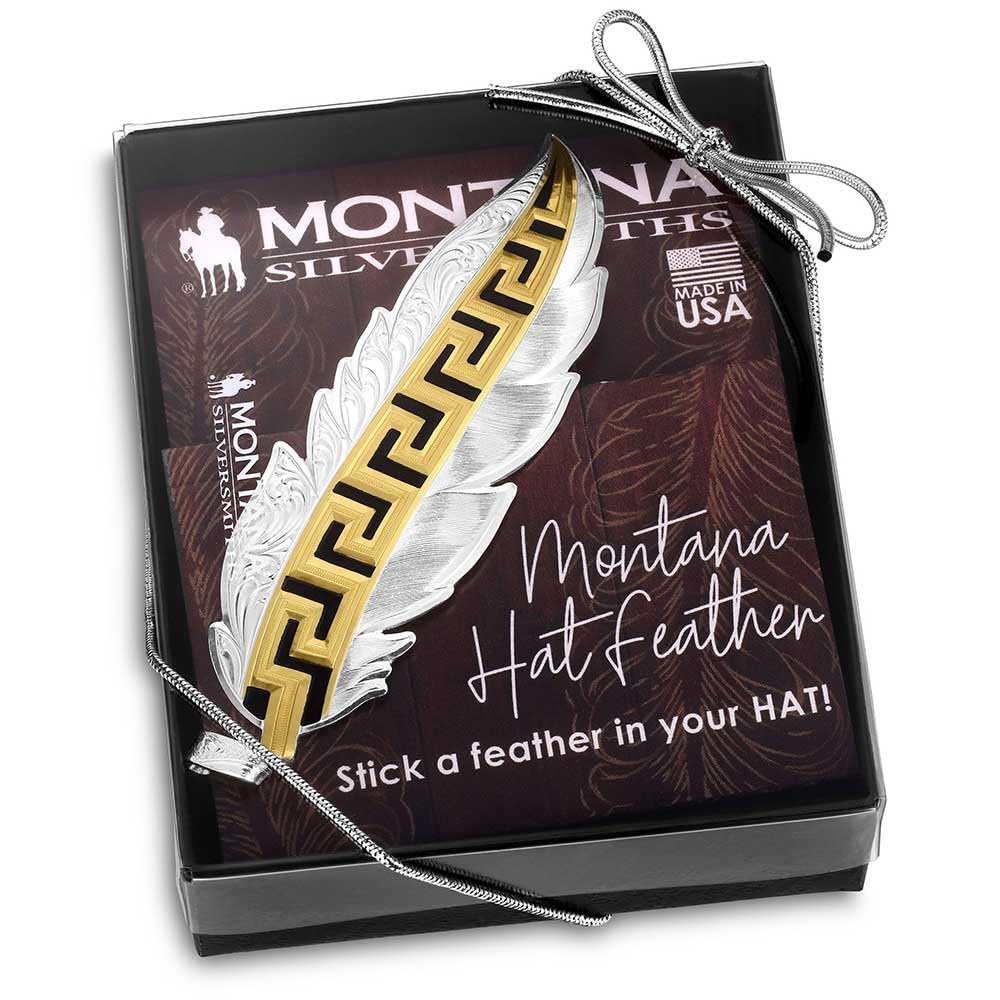 
                  
                    Gold and silver feather ornament in a Montana Silversmiths box on a white background
                  
                