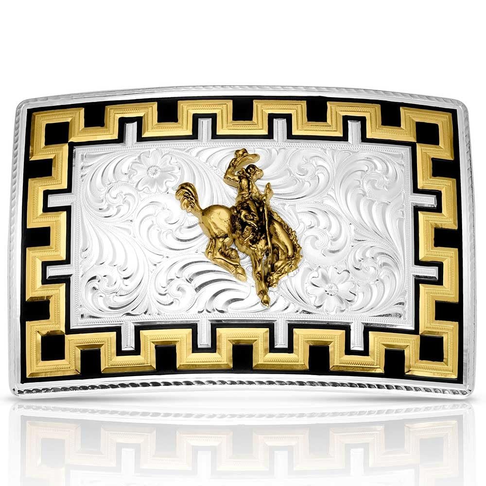 Belt buckle with gold cowboy figure and intricate design on a white background