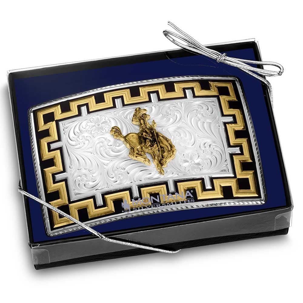 Decorative metal plate with a gold cowboy design on a blue background