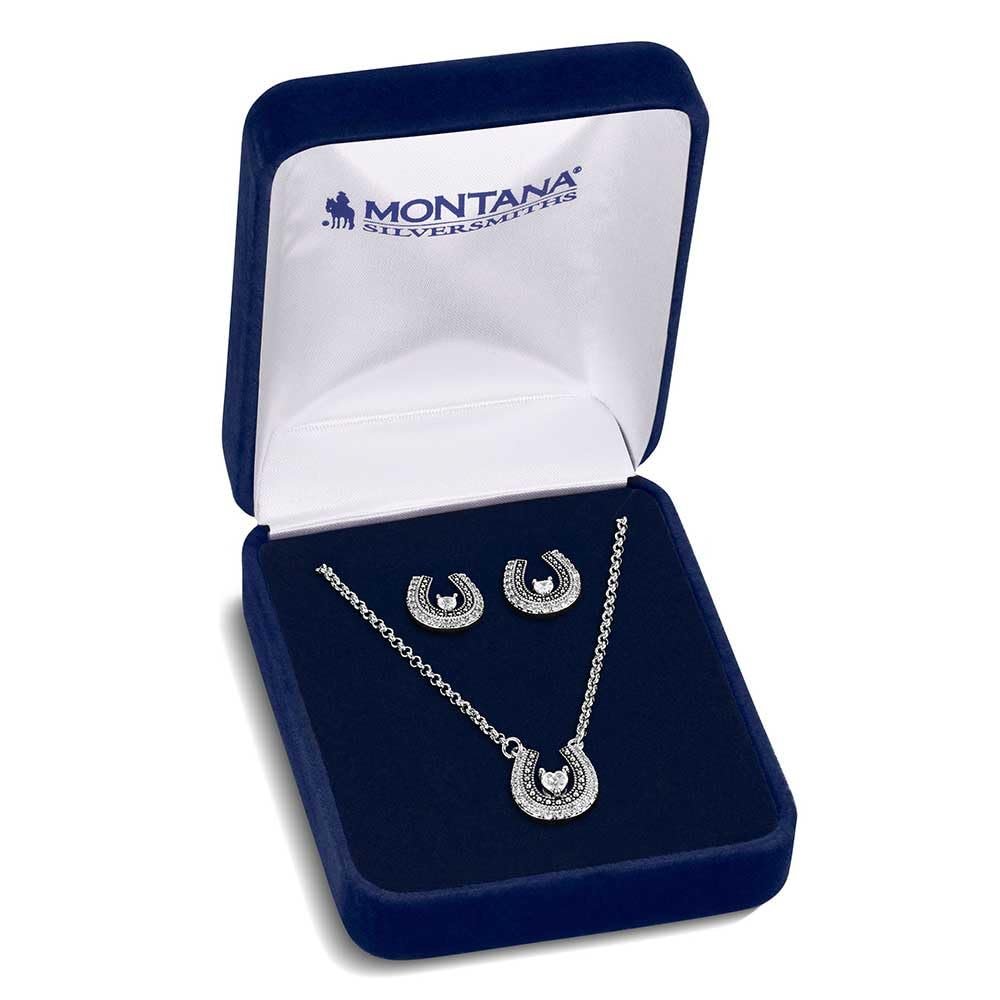 Silver necklace and earrings set in a Montana Silversmiths box on a white background