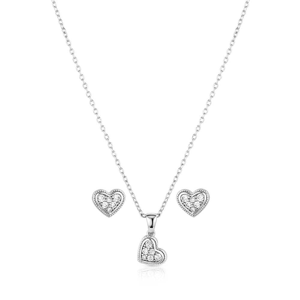 Heart-shaped silver necklace and earrings on a white background
