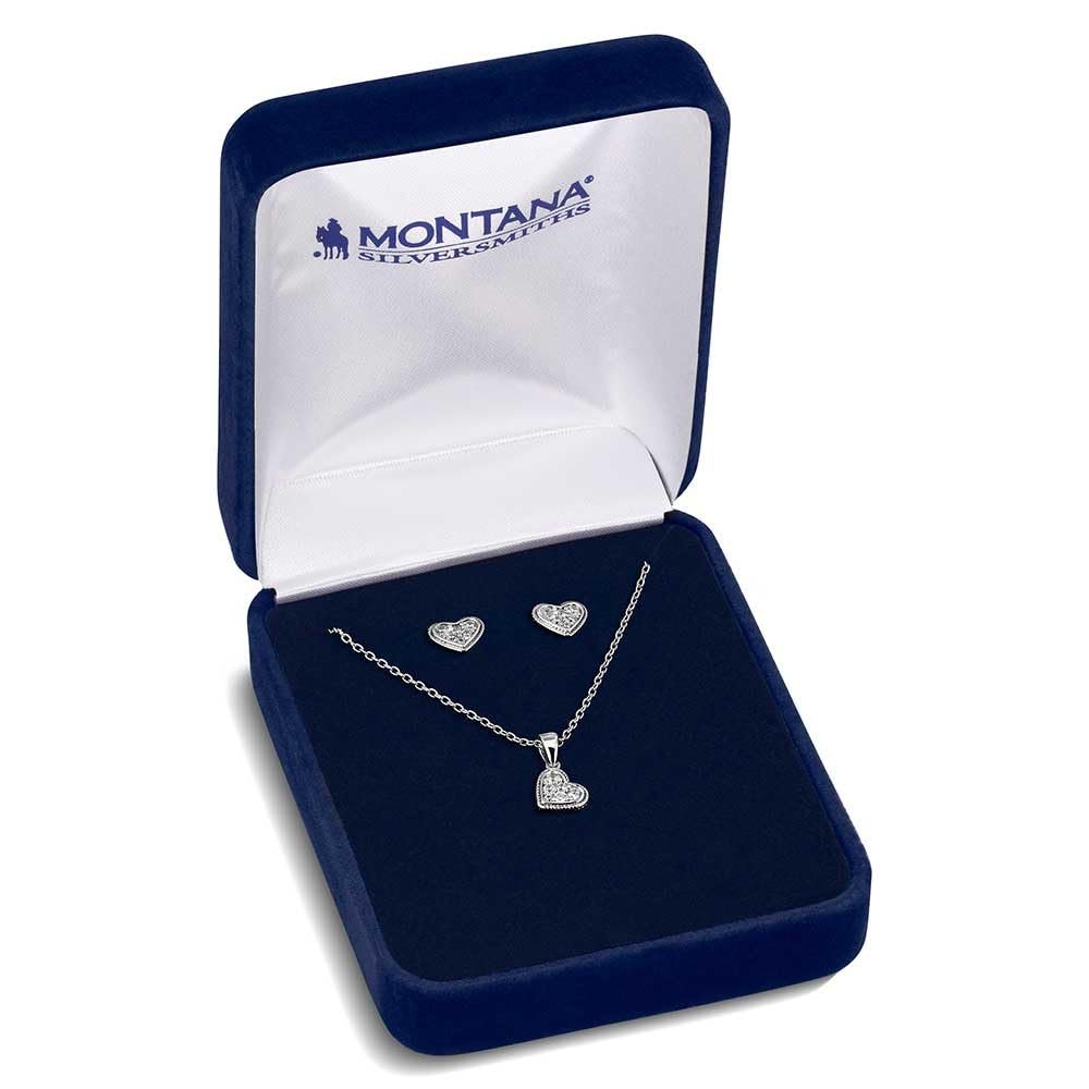 
                  
                    Silver heart necklace and earrings set in a Montana Silversmiths box on a white background
                  
                